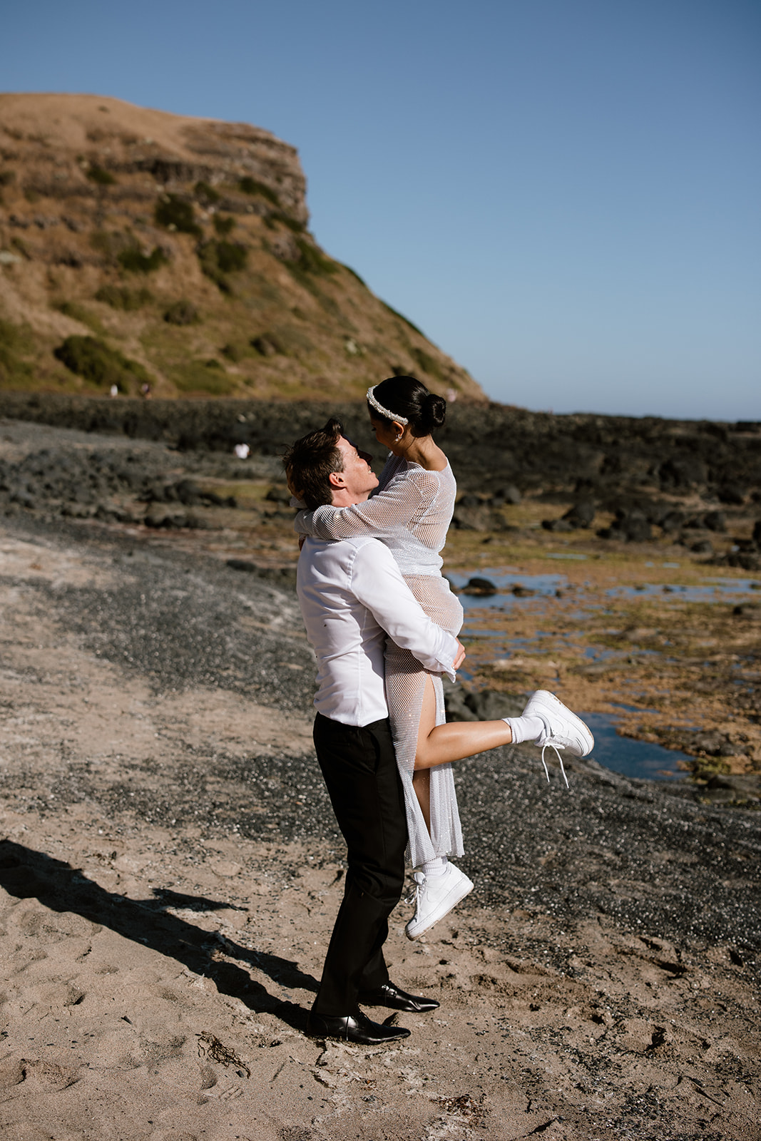 couples wedding photo bride in sneakers and bodysuit