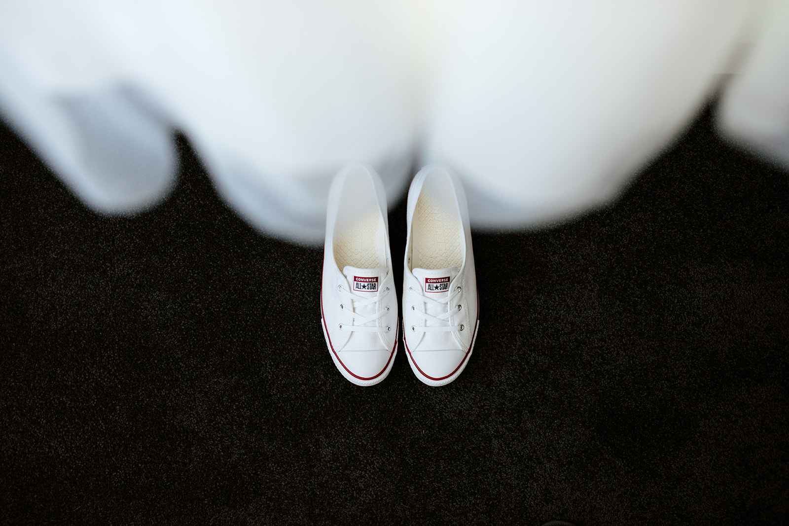 brides converse shoes with wedding dress