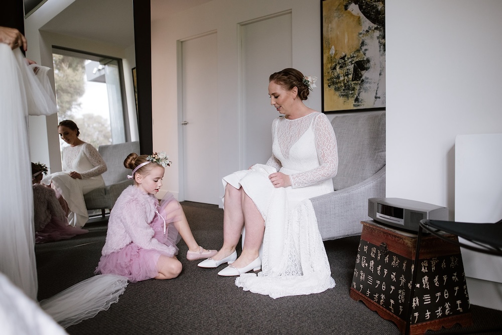 bride putting on Mary Jane Shoes