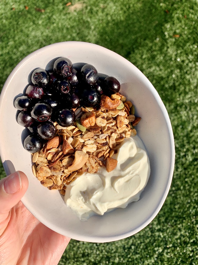A bowl of food with blueberries and yogurtAI-generated content may be incorrect.