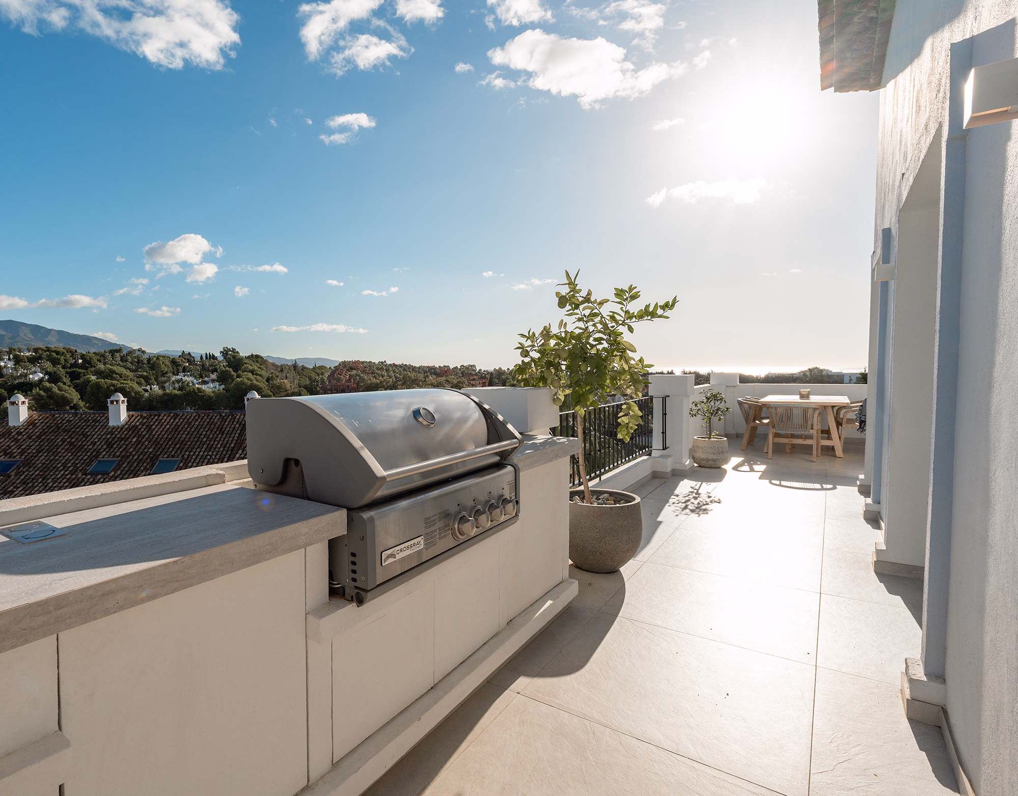 Breakfast setup on the terrace of Las Lolas penthouse with morning mountain view