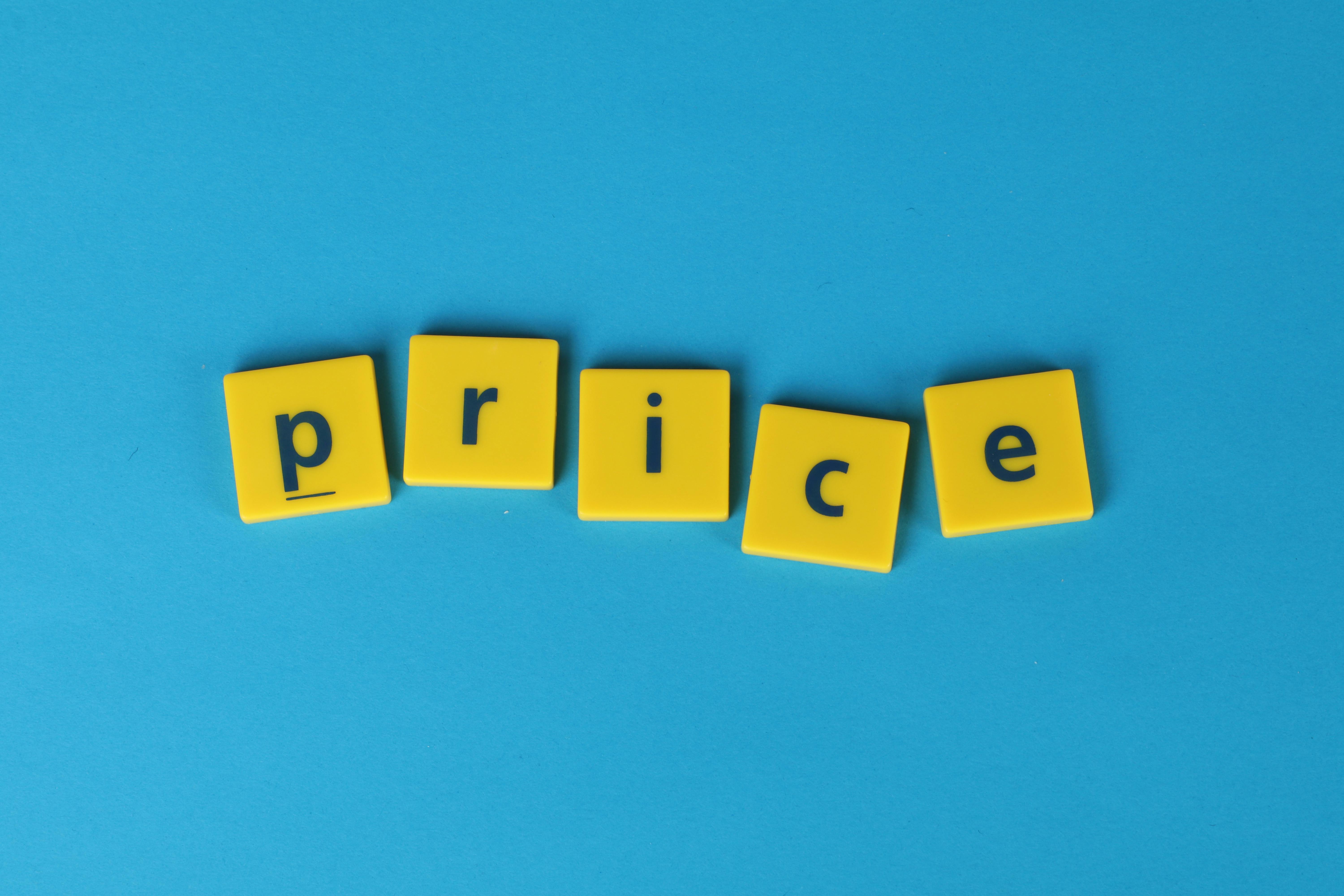 A blue background with yellow tiles spelling out "price" signifying the artile is about the price of sober living