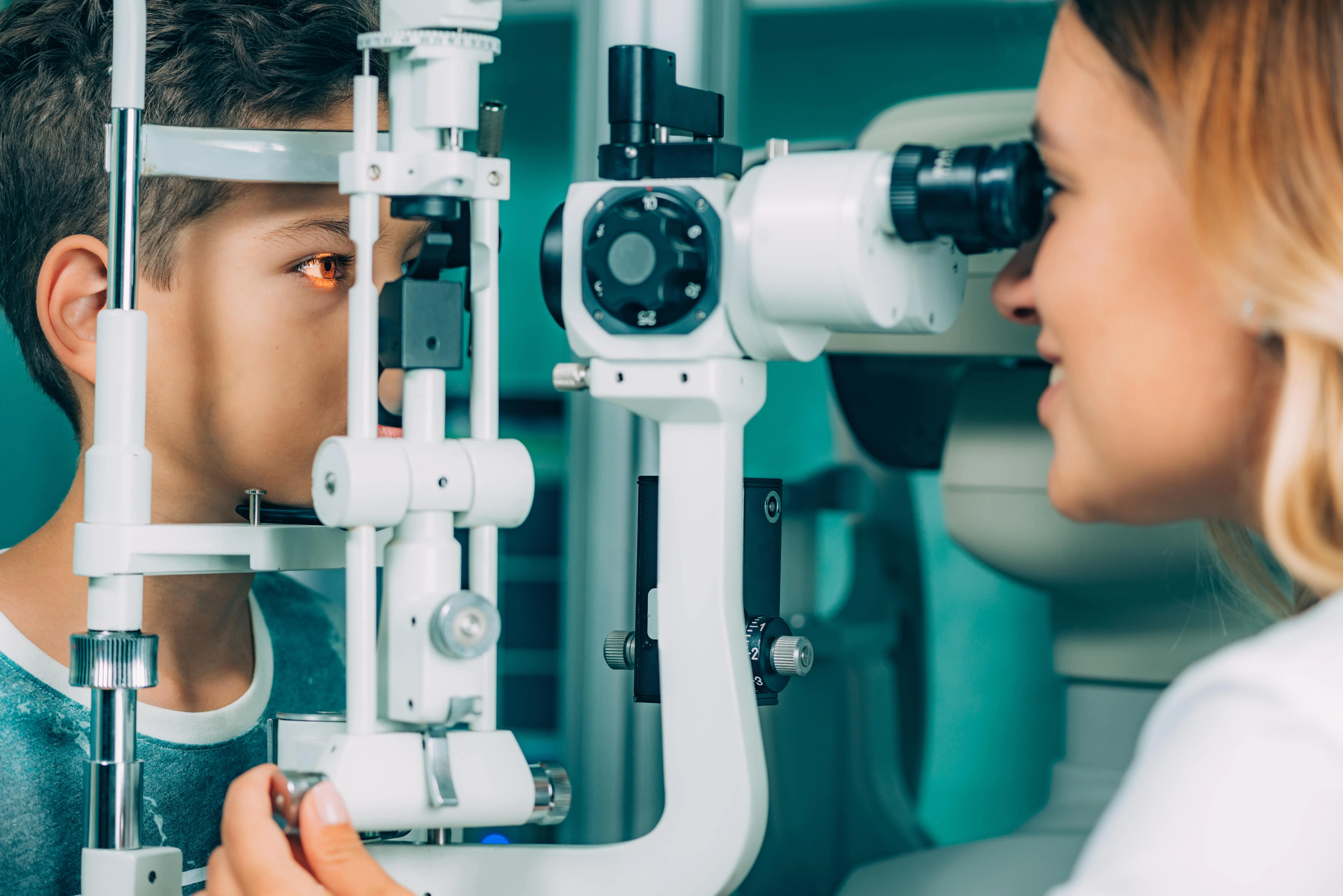 Eye exam with optometrist using slit lamp for detailed eye examination