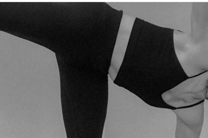 Editorial black-and-white photography of a New Yorker in athletic wear, highlighting the confidence of dry underarms after hyperhidrosis treatment.