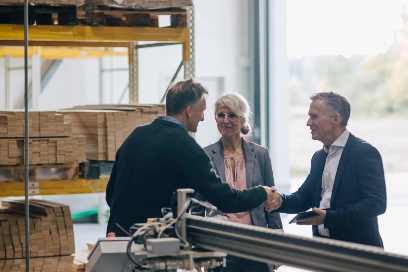 people meeting and talking in a warehouse