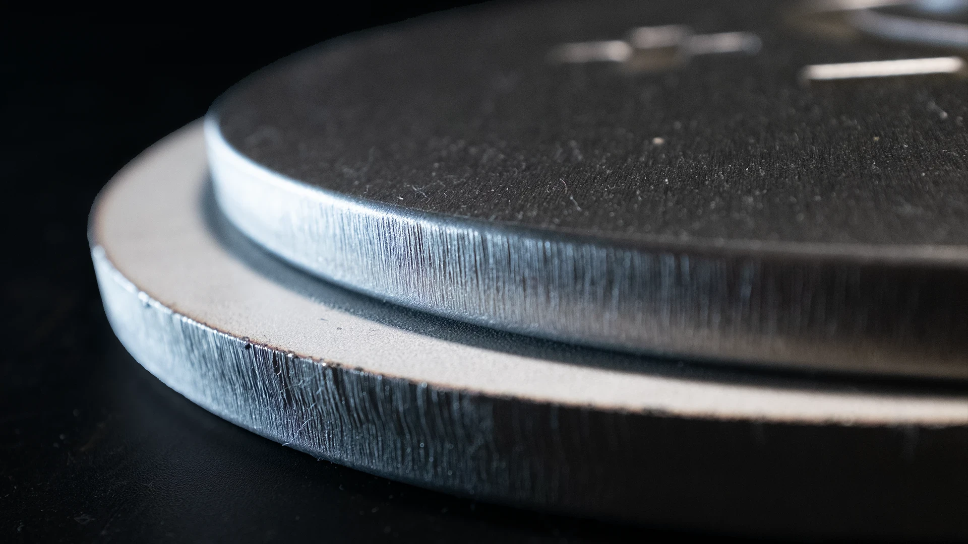 Two workpieces stacked together showing the before and after results