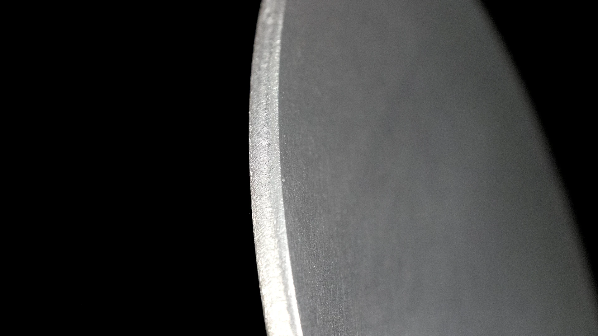 A stainless steel workpiece demonstrating perfect edge rounding result