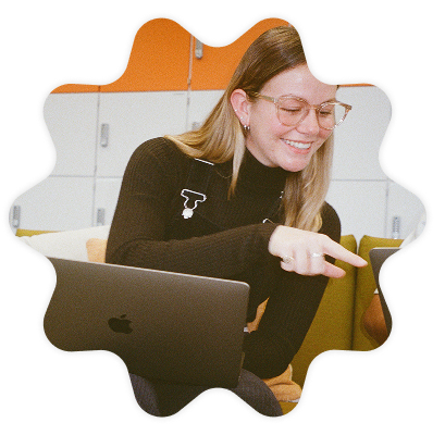 A young female Penguin Books UK employee working on her laptop