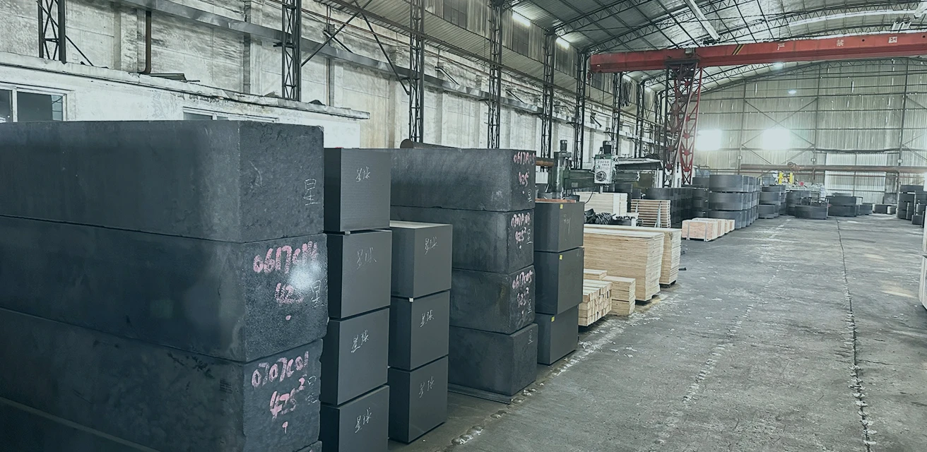 A factory showing a pile of graphite chunks