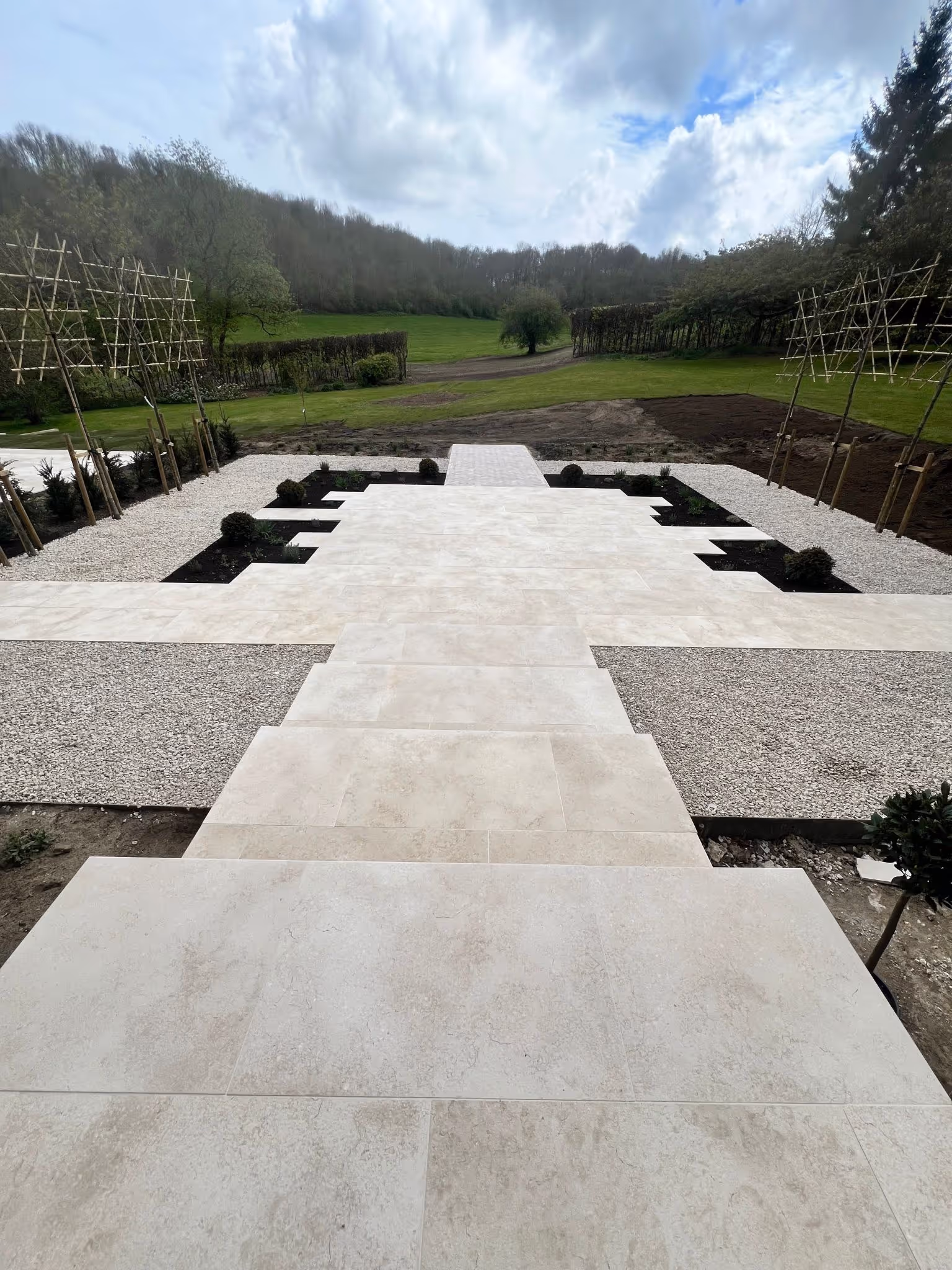 Contemporary outdoor space with tiled steps and landscaped surroundings