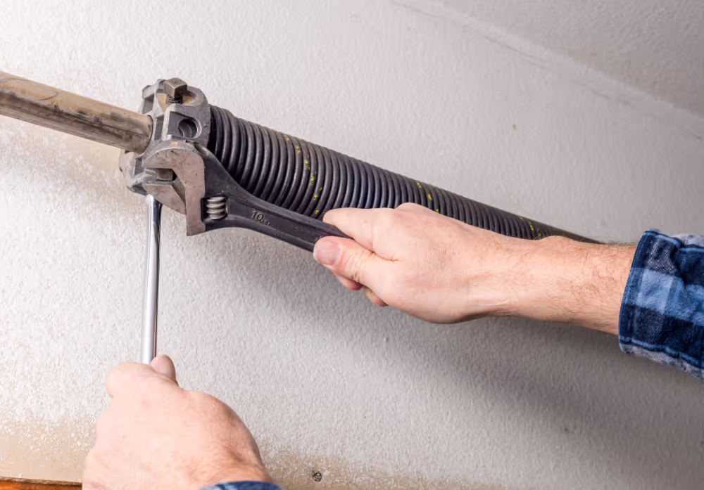 Garage door spring repair and adjustment by professional