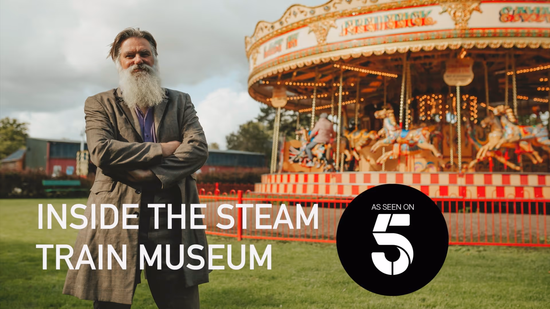Bressingham Steam Museum manager stands in front of a carousel with his arms folded, text on screen says "Inside the steam train museum, as seen on 5" 