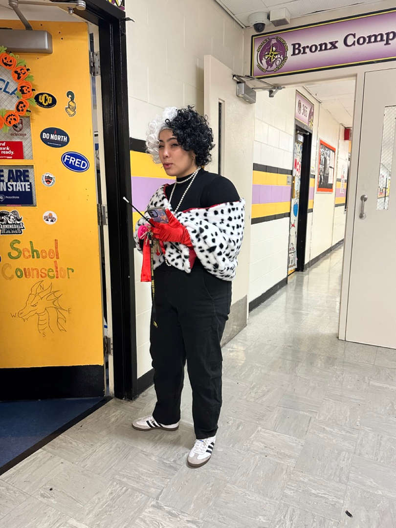 Student standing at a vending machine in a school hallway
