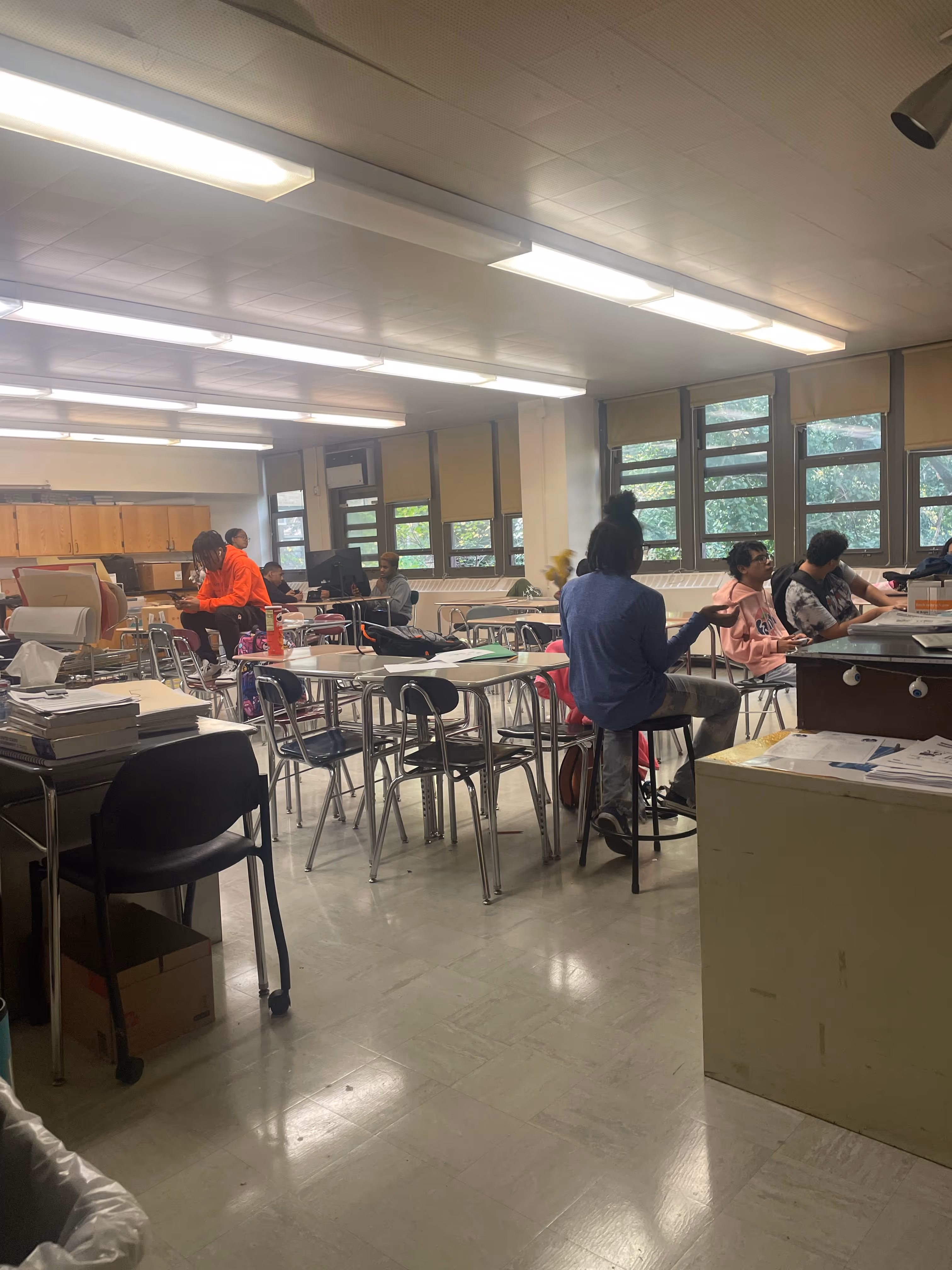 Students working at tables in classroom during Video Game Club