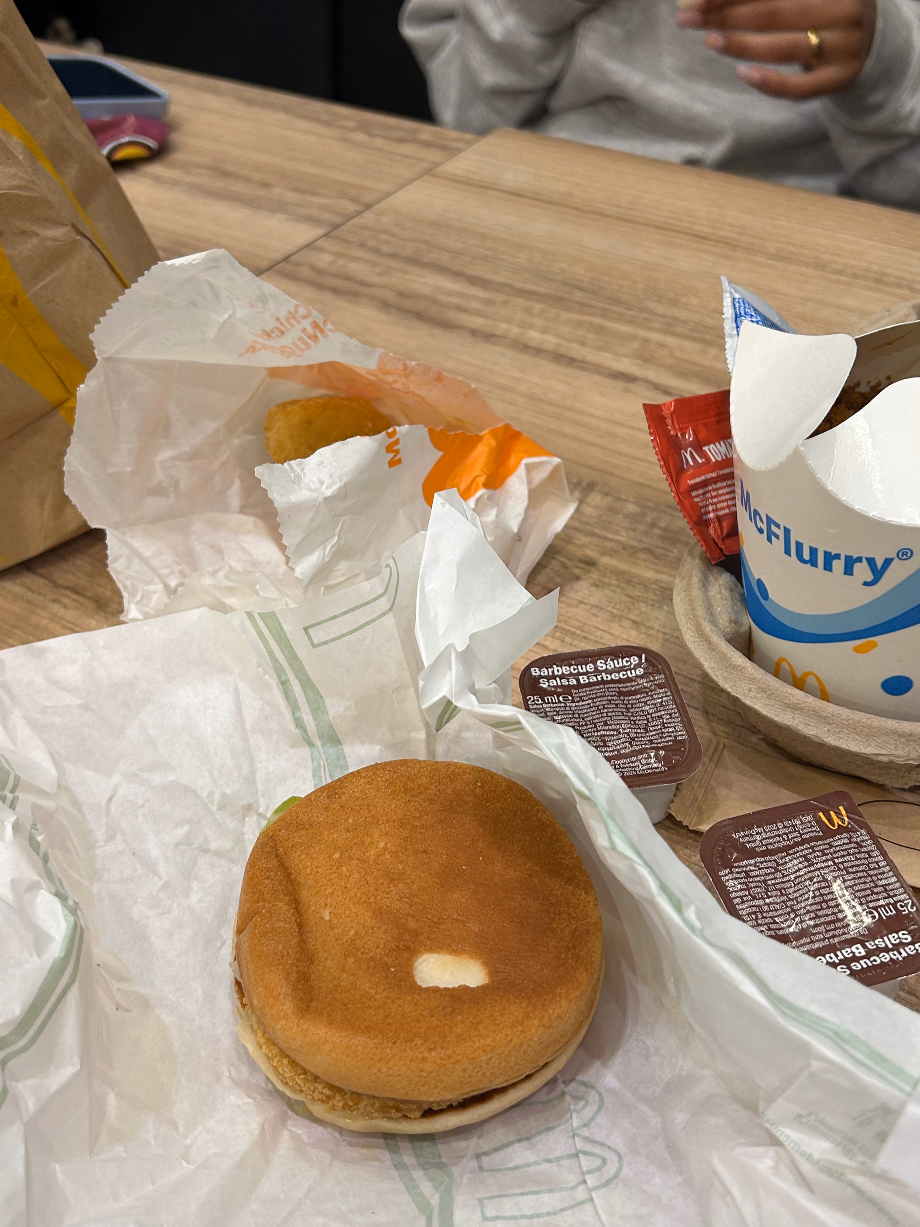 Fast food meal with burger and McFlurry on table