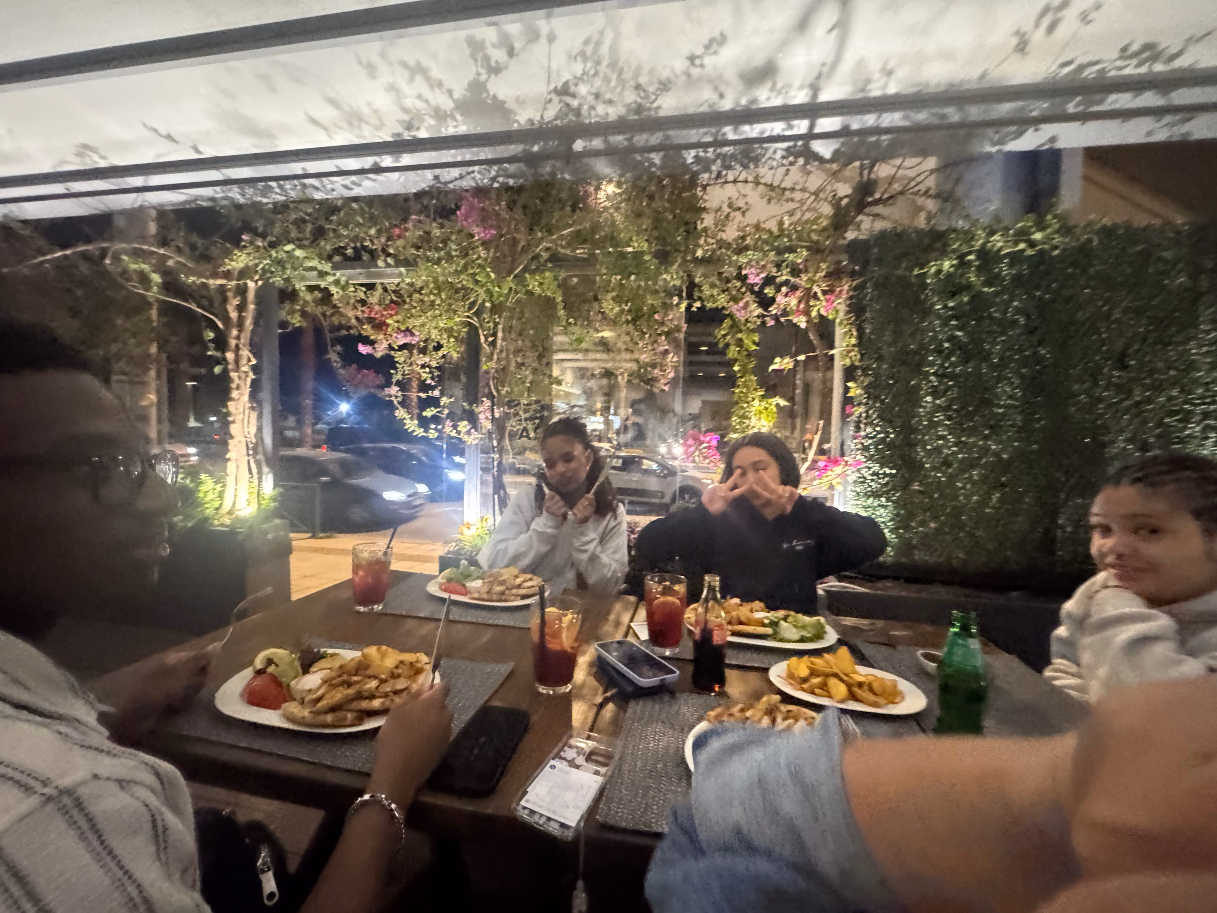 Students dining together at outdoor restaurant