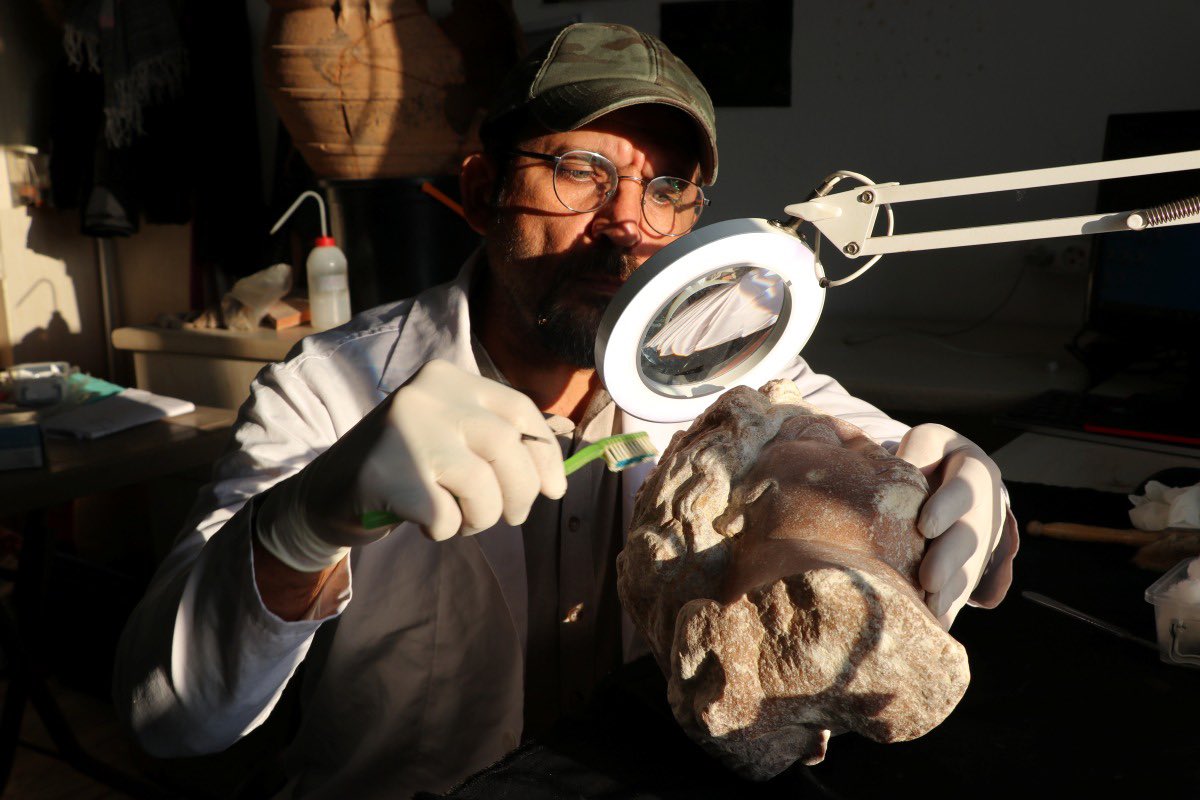 Archaeologists in Turkey work on the recovery and restoration of statue heads of ancient gods—including representations of Aphrodite and Dionysus—uncovered among the remains of an ancient settlement.