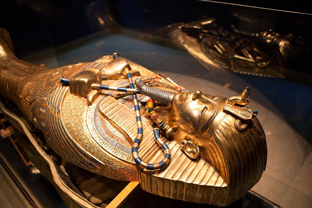 Golden sarcophagus of Tutankhamun, part of the complete funerary collection displayed at the Grand Egyptian Museum.