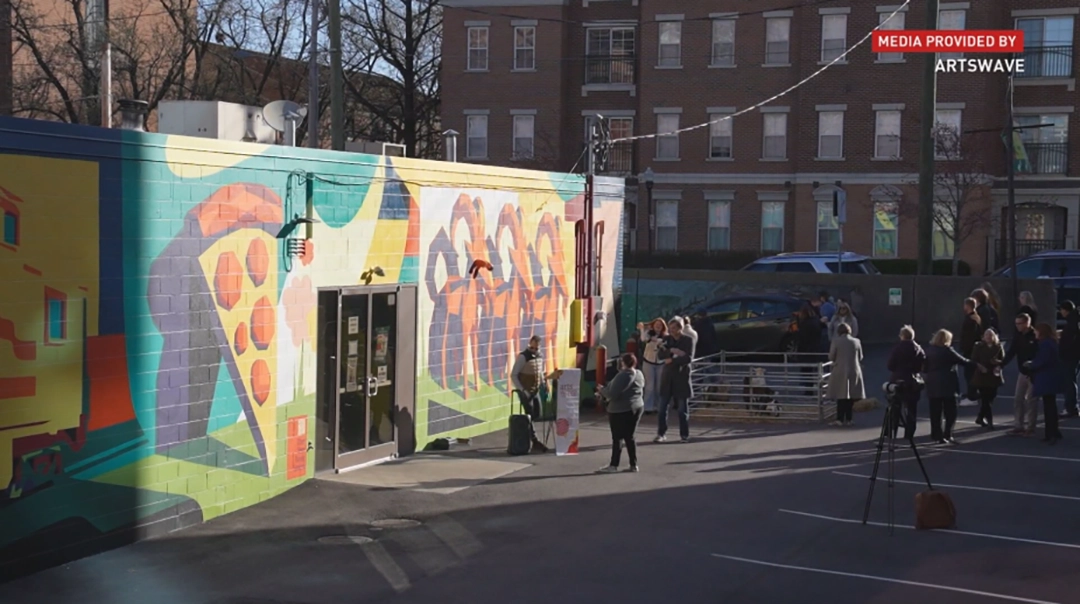 Visitors gather during the unveiling of Pineapple on Pizza at The Gruff, Covington, as part of the Spray It Forward program. Courtesy of ArtsWave.