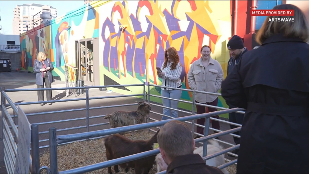 Public engagement during the opening of Pineapple on Pizza, highlighting the community-oriented nature of the project. Courtesy of ArtsWave.