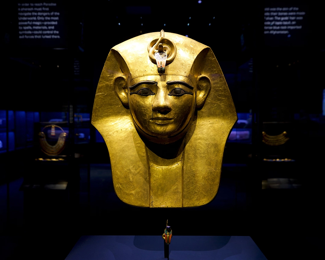 The gilded wooden mask from the sarcophagus of Pharaoh Amenemope, whose bracelet is missing. 21 Dynasty.