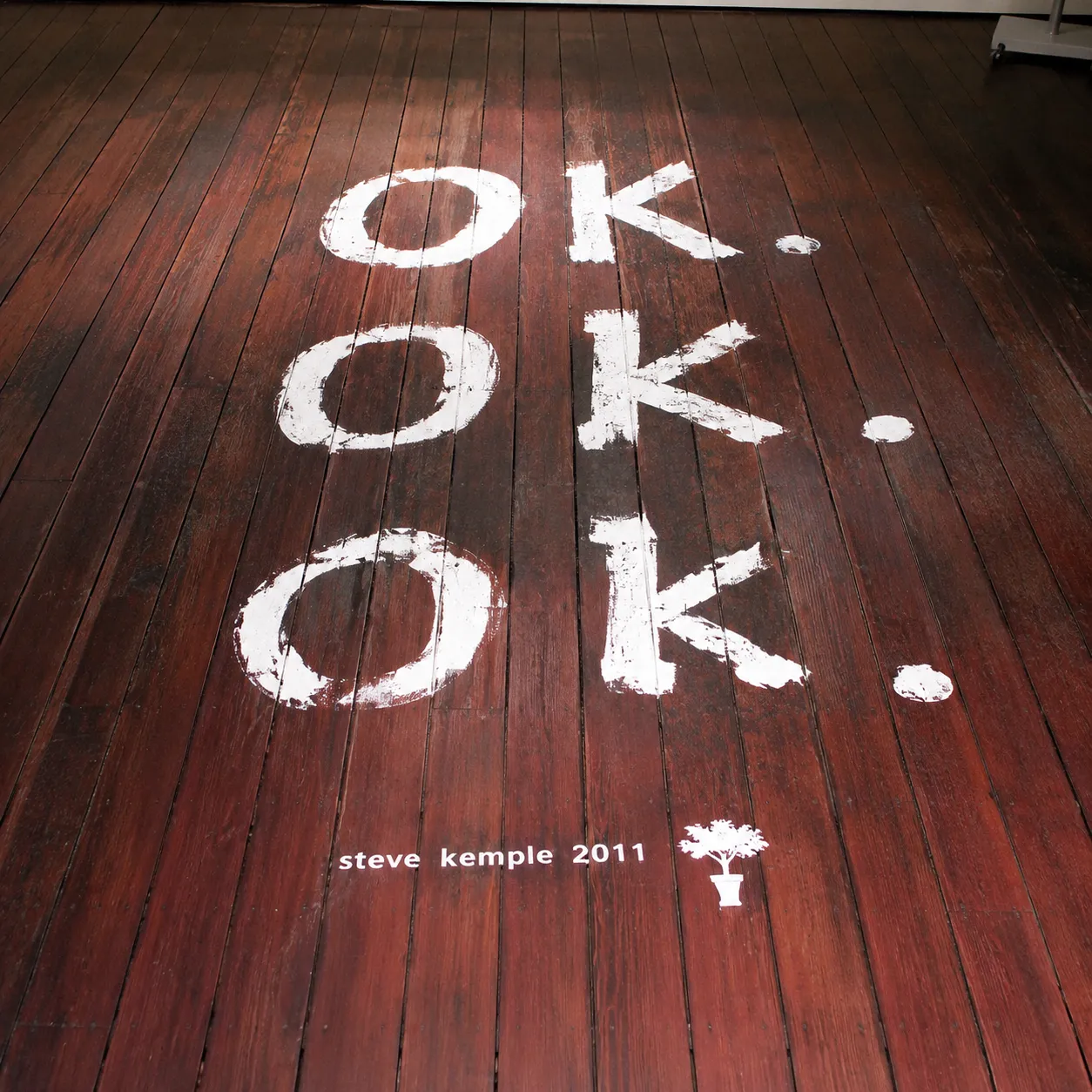 Steve Kemple, OK., 2011, floor text intervention, digitally reconstructed from a low-resolution Wayback thumbnail.