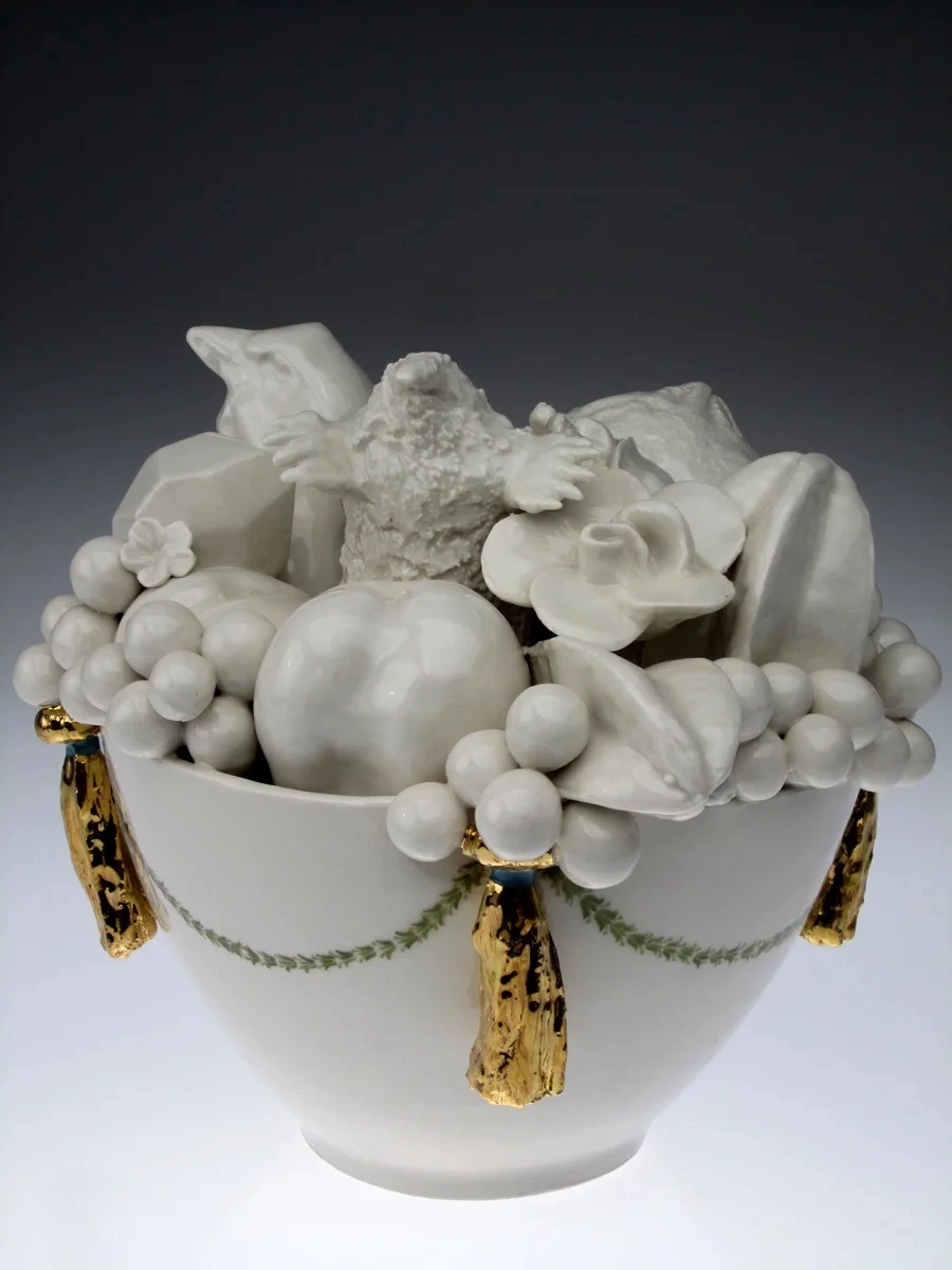 Porcelain bowl and natural forms in a sculpture from Still[ed] Life by Katie Parker and Guy Michael Davis, 2011.
