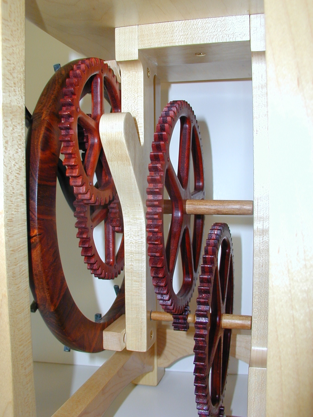 Keith Chambers, wooden gear clock with padauk gears and a maple cabinet. Woodwerks, Lexington, Kentucky.