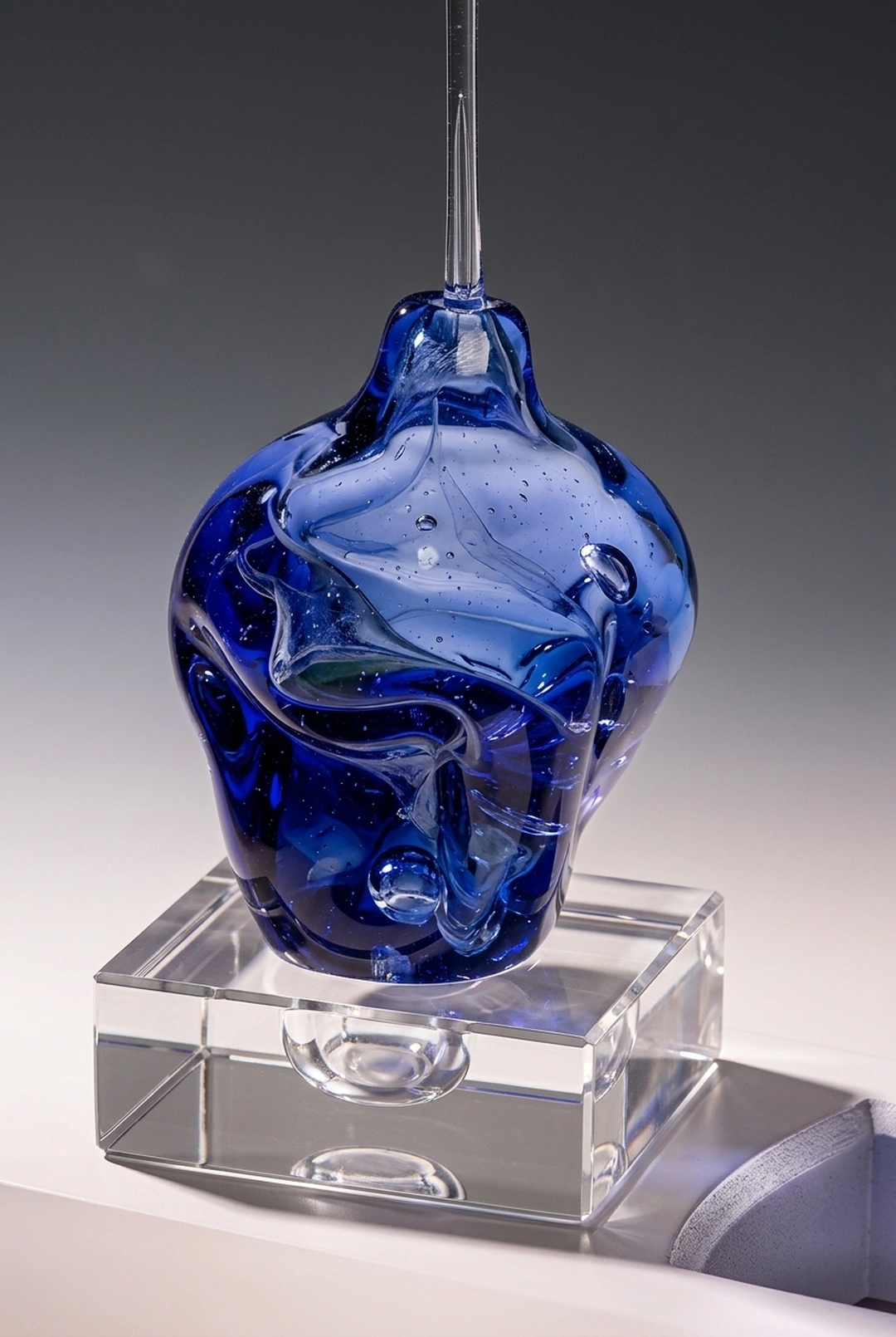 Michael Gore, Cobalt Dreidel, blown Venetian glass with lucite stand.