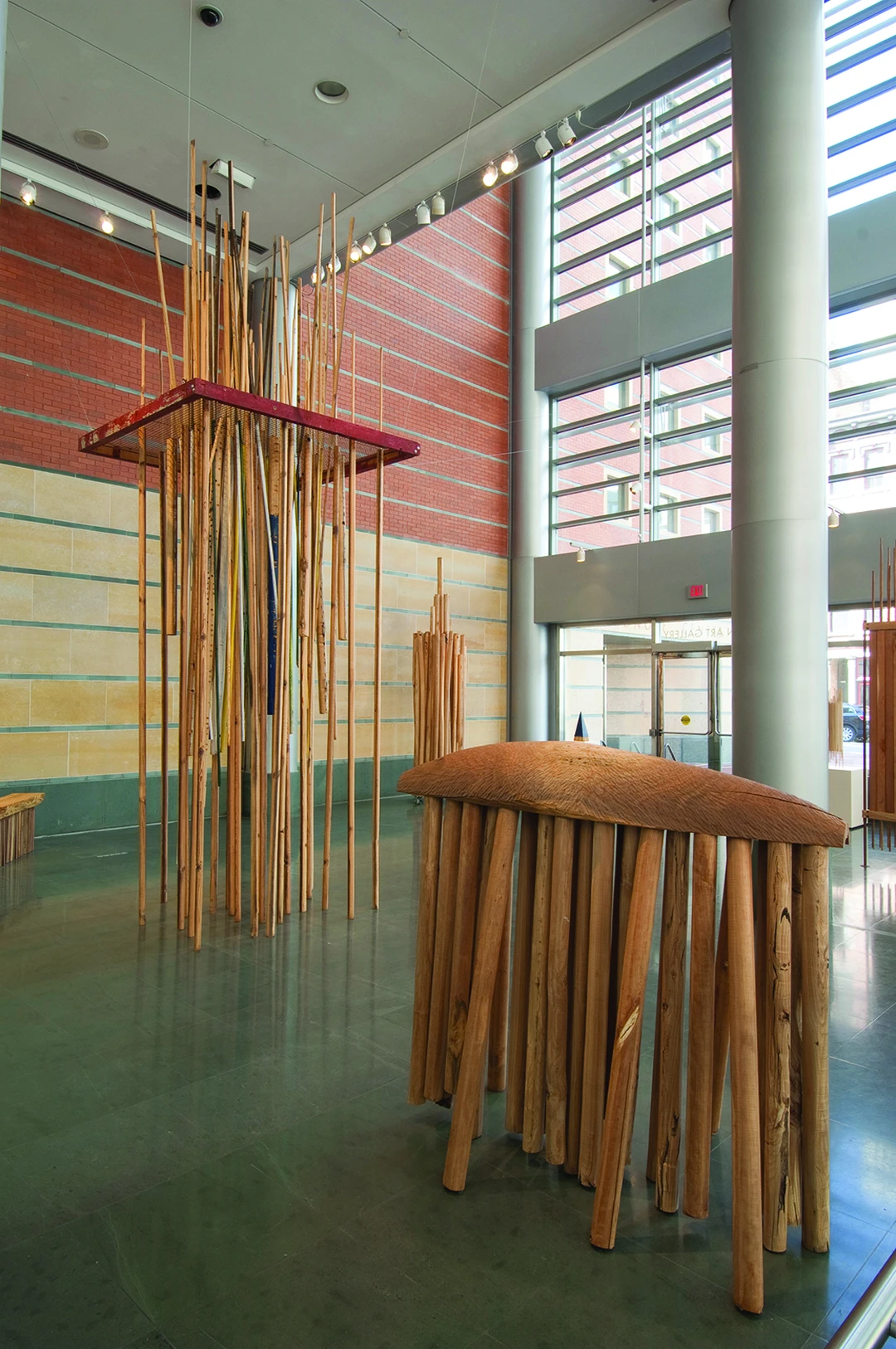 Robert Fry, (left) Into the Wild, metal, paint, and wood; (right) Stepping Out, walnut, cherry, and beech wood.