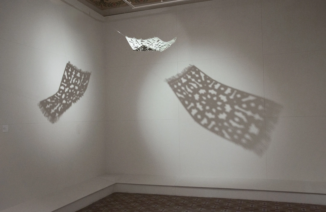 Abdullah M. I. Syed, The Flying Rug, installation view, hand-folded US dollar bills and staple pins.