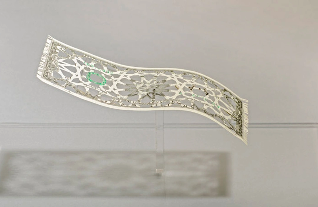 Abdullah M. I. Syed, Deconstruction of the Myth of the Flying Rug, hand-cut dollar bill in custom vitrine.