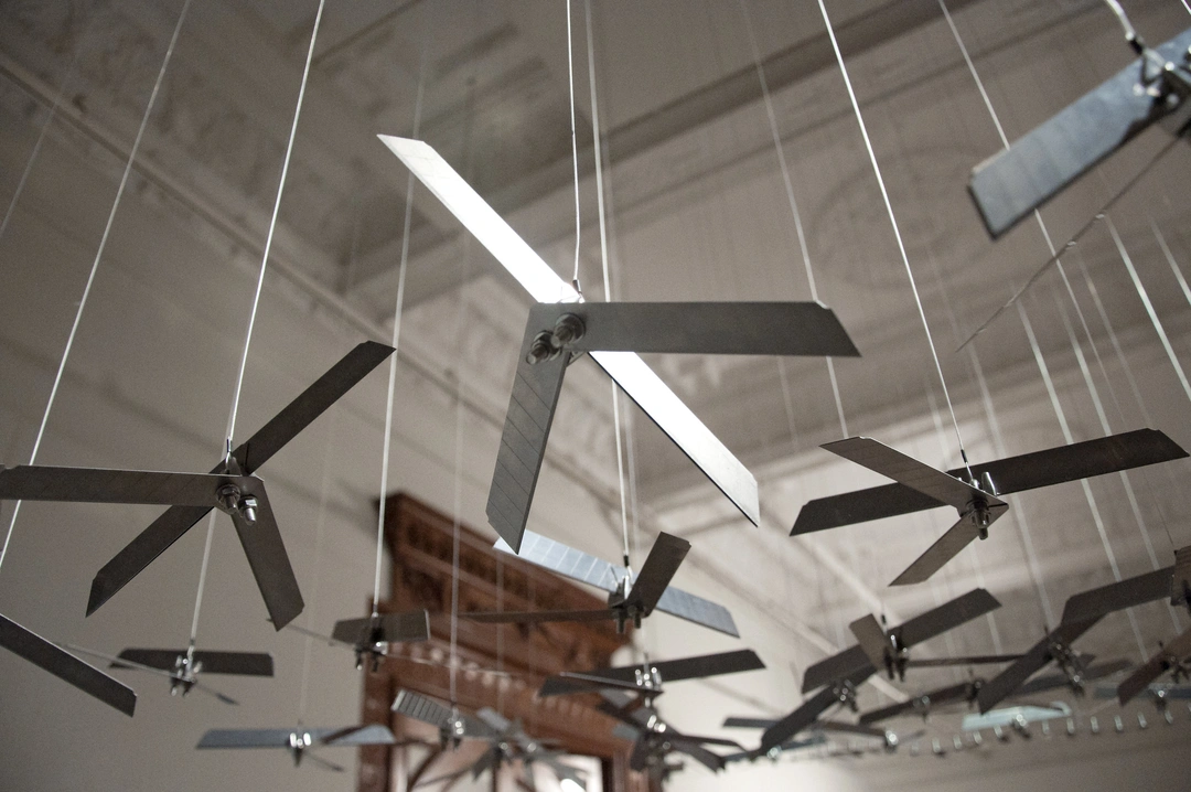 Abdullah M. I. Syed, The Flying Rug of Drones, detail of suspended box-cutter blades forming aerodynamic silhouettes.