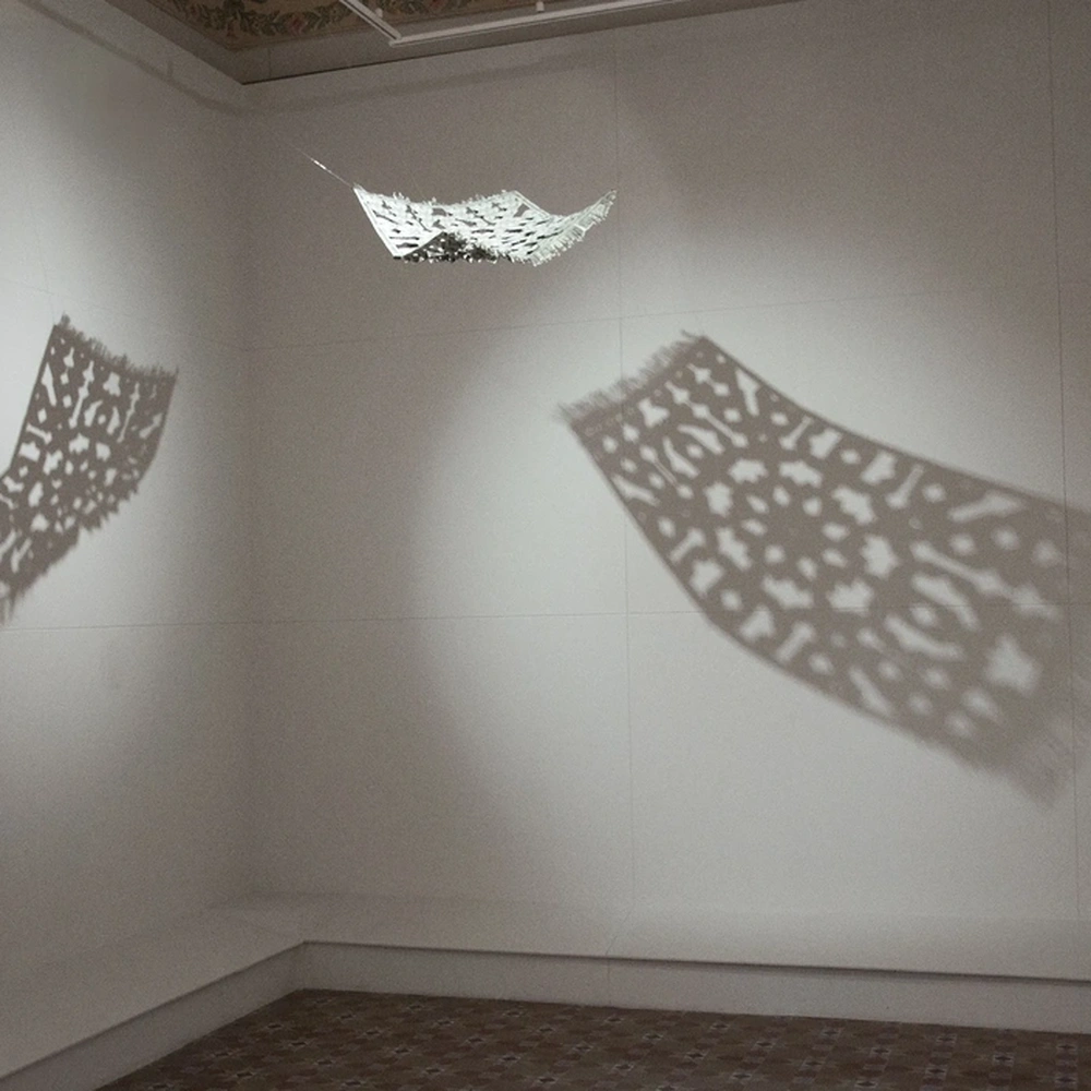 Abdullah M. I. Syed, The Flying Rug, installation view detail with suspended currency carpet.