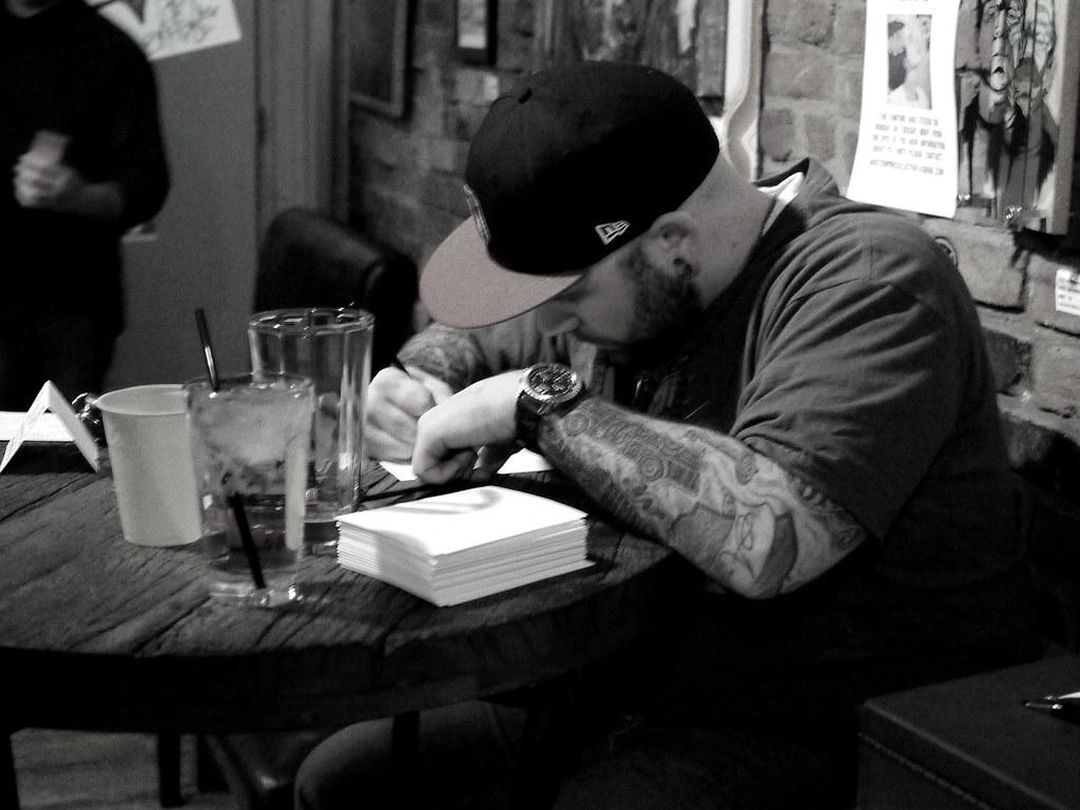 Anthony 'Tank' Mansfield sketching custom Valentine's Day cards at The Famous Neons Unplugged, February 11, 2012
