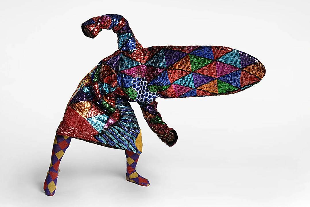 Nick Cave, Soundsuit, 2010. Harlequin sequined fabric with elongated horizontal headpiece. Photo: James Prinz.