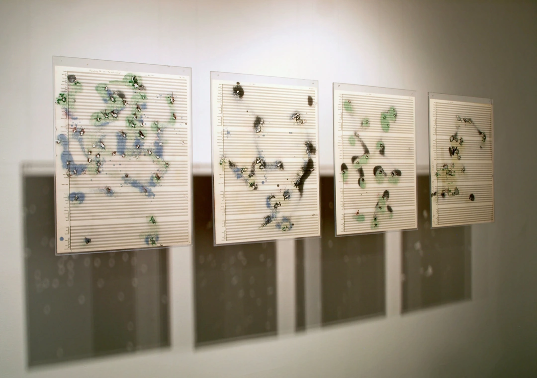 Dick Higgins, Symphony #186: The Well-Colored Symphony, from A Thousand Symphonies, 1968/1997. Orchestral paper, gunshot holes, spray paint, 22.5" x 17.5" each.
