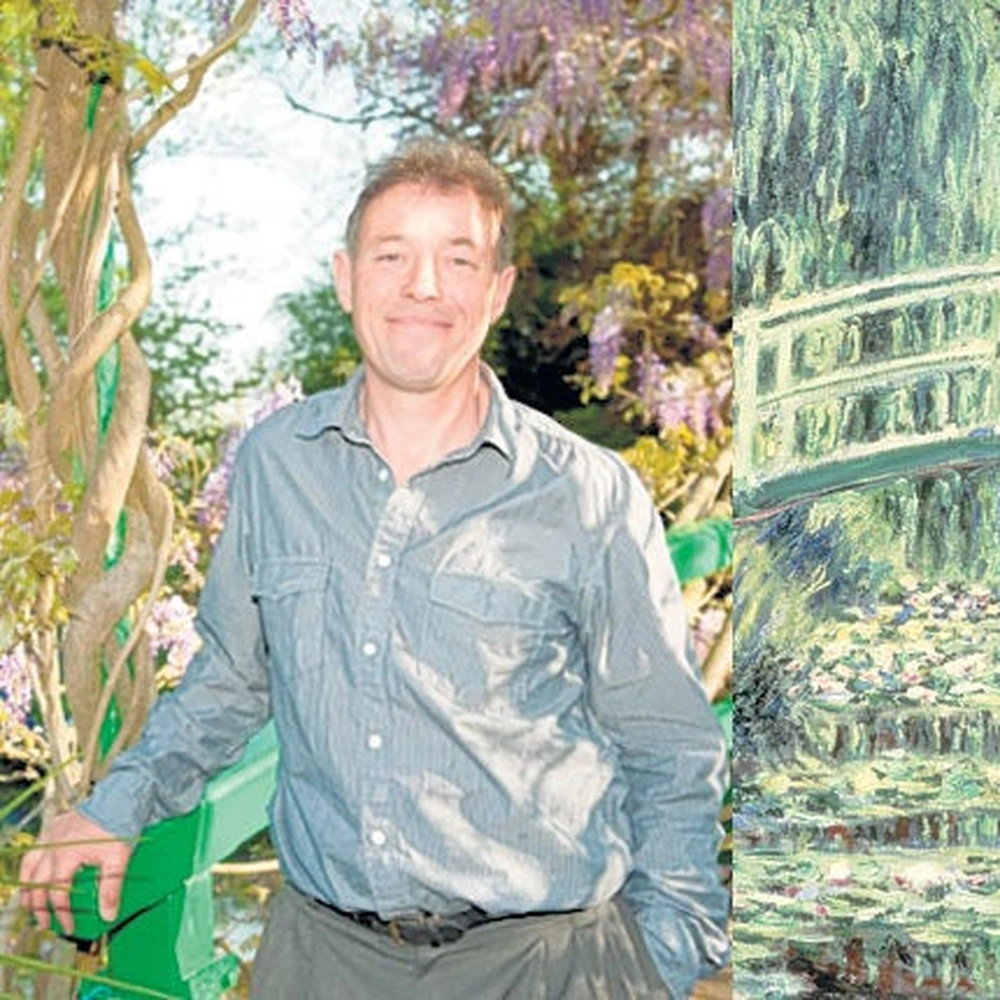 James Priest beside Claude Monet's Japanese bridge painting, 2011.