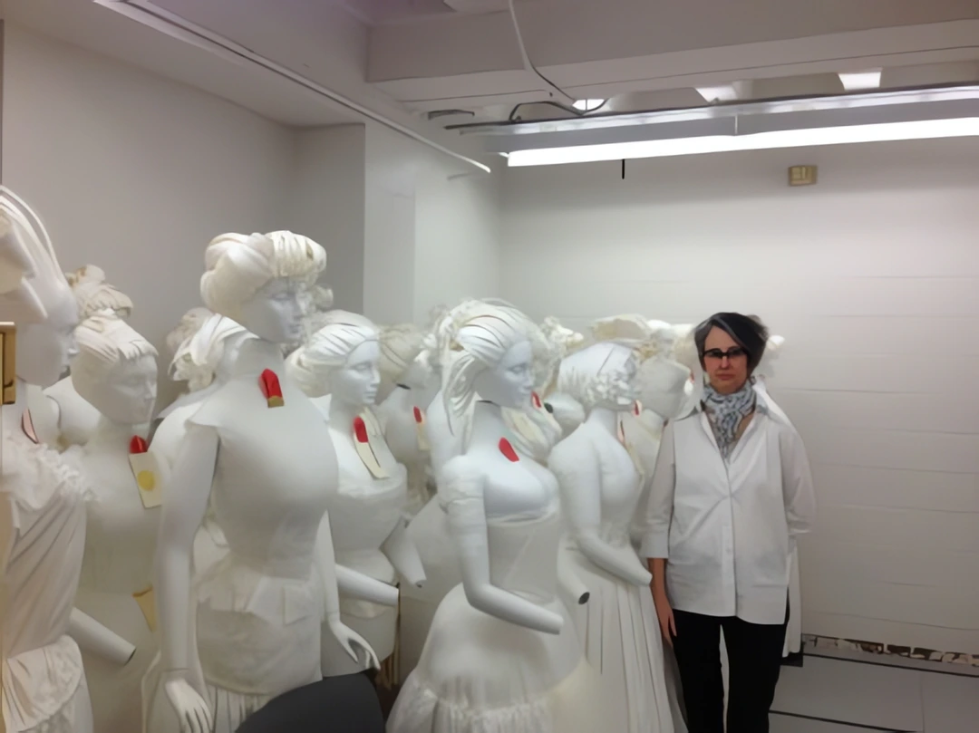 Cynthia Amnéus with mannequins in compact storage vault
