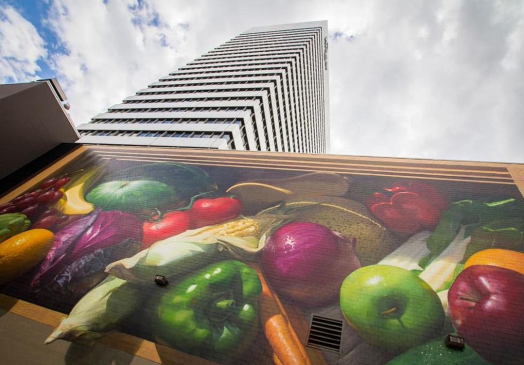 Jonathan Queen’s “Fresh Harvest” mural (48 x 90 ft) beneath the Kroger headquarters tower, Cincinnati. Photograph by Ronald M. Salerno, via visitcincy.com. (Related image located during this archive’s reconstruction.)