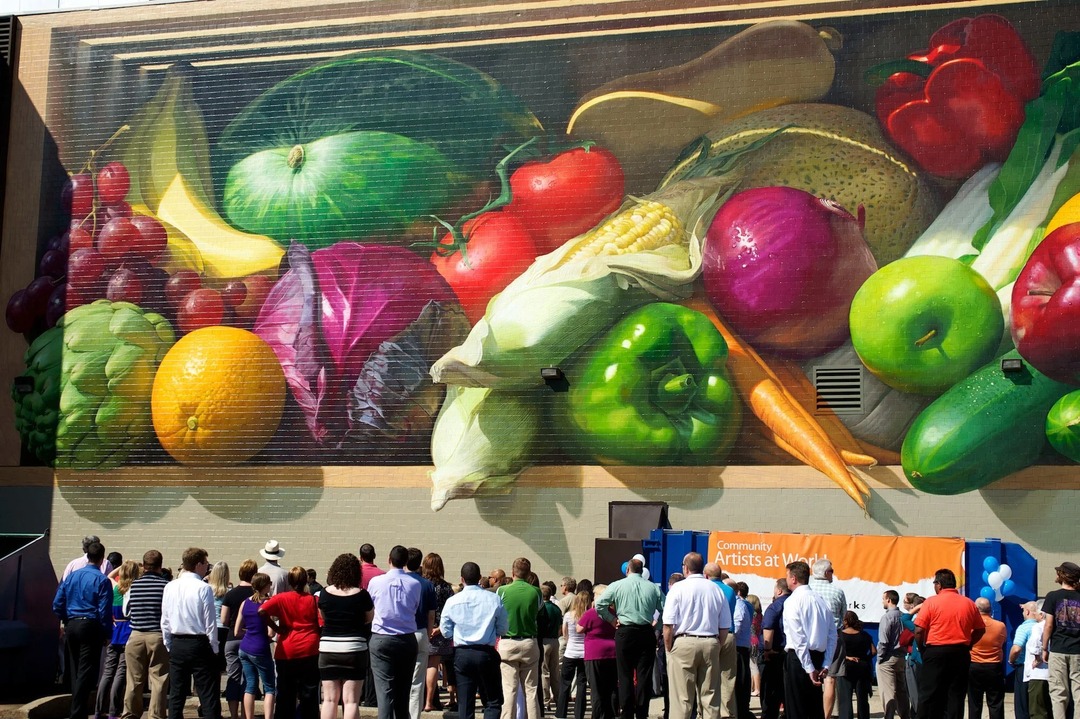 Crowd at the dedication ceremony for Jonathan Queen’s “Fresh Harvest” mural, Kroger Headquarters, Cincinnati, August 2012. Photograph via markmalloryconsulting.com. (Related image located during this archive’s reconstruction.)