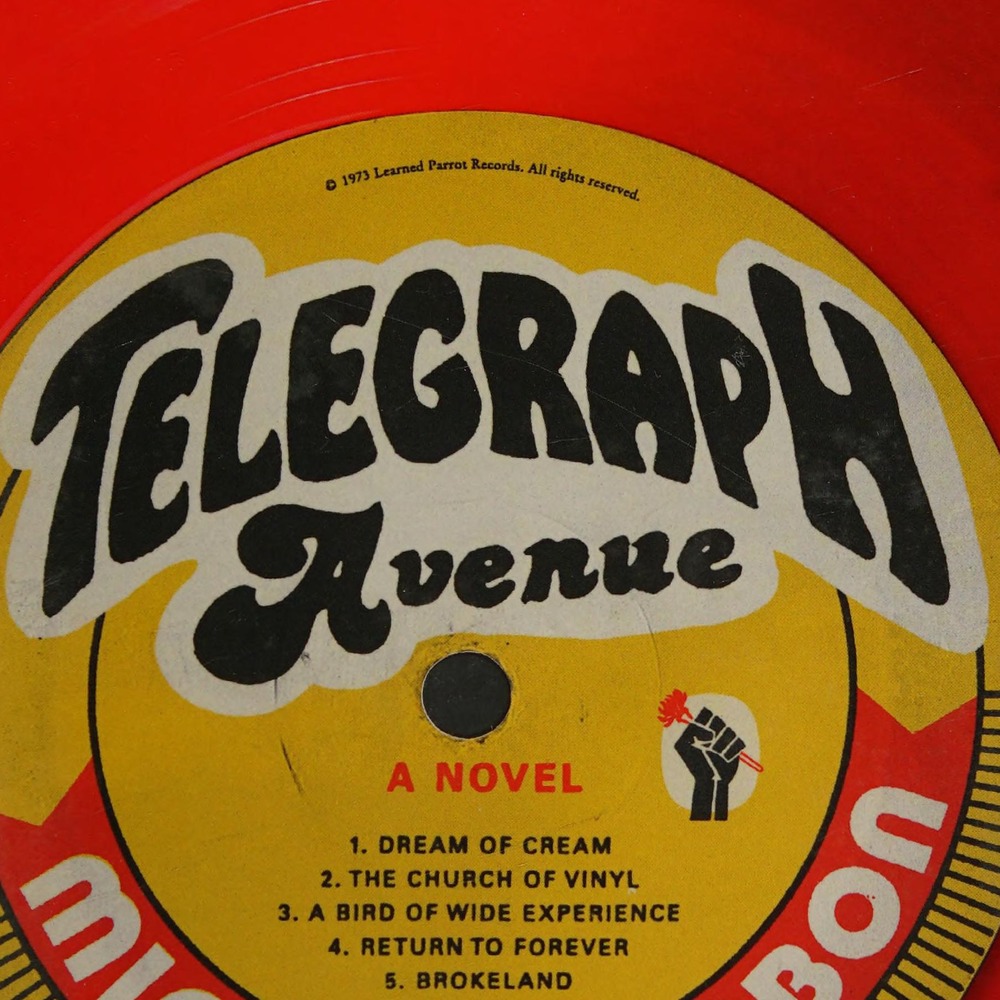Close-up of the yellow vinyl-record label reading ‘Telegraph Avenue’.