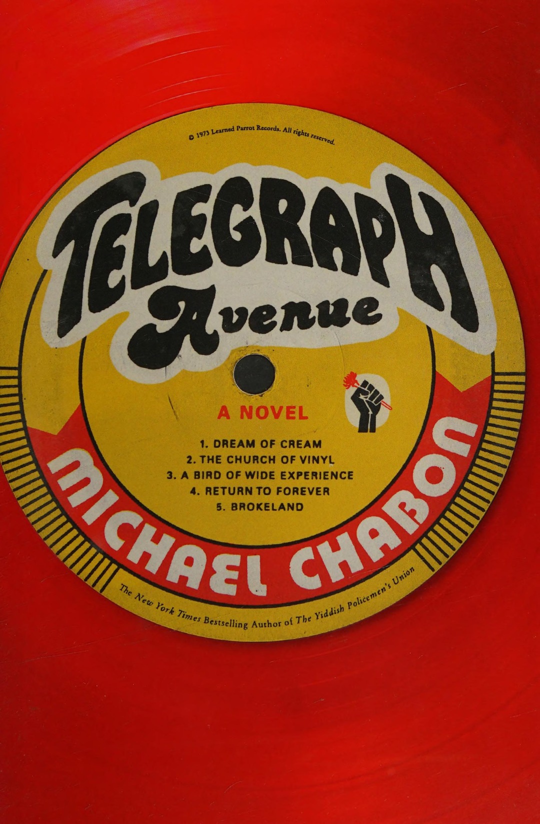 Book cover designed as a red vinyl record with a yellow label reading ‘Telegraph Avenue’ and ‘Michael Chabon’.