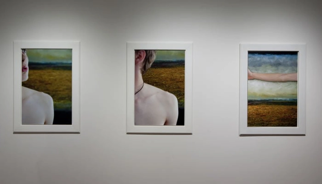 Three white-framed photographs show cropped faces, bare shoulders and an extended arm against a landscape painting, displayed side by side.