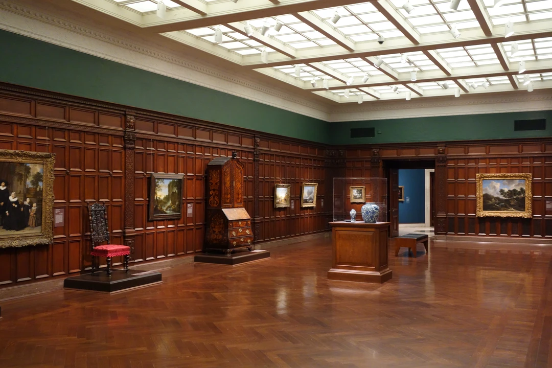 European painting and decorative arts gallery at the Cincinnati Art Museum, showing framed master paintings and historic wood paneling.