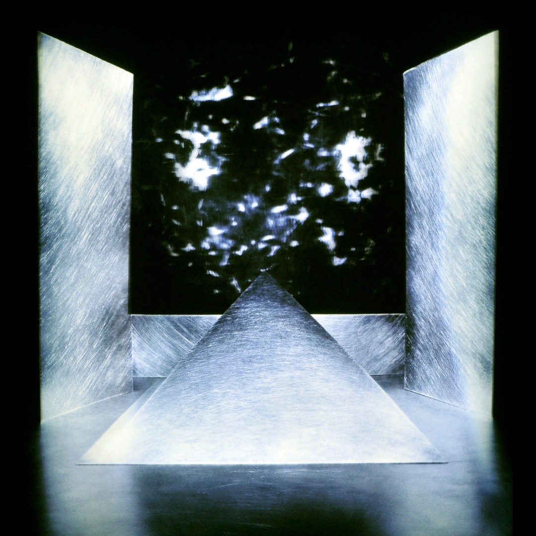 Two luminous upright panels flank a triangular form pointing into a dark square with scattered bright reflections. Connie Sullivan, Alchemy of Entrancement series. (Related image located during this archive's reconstruction.)