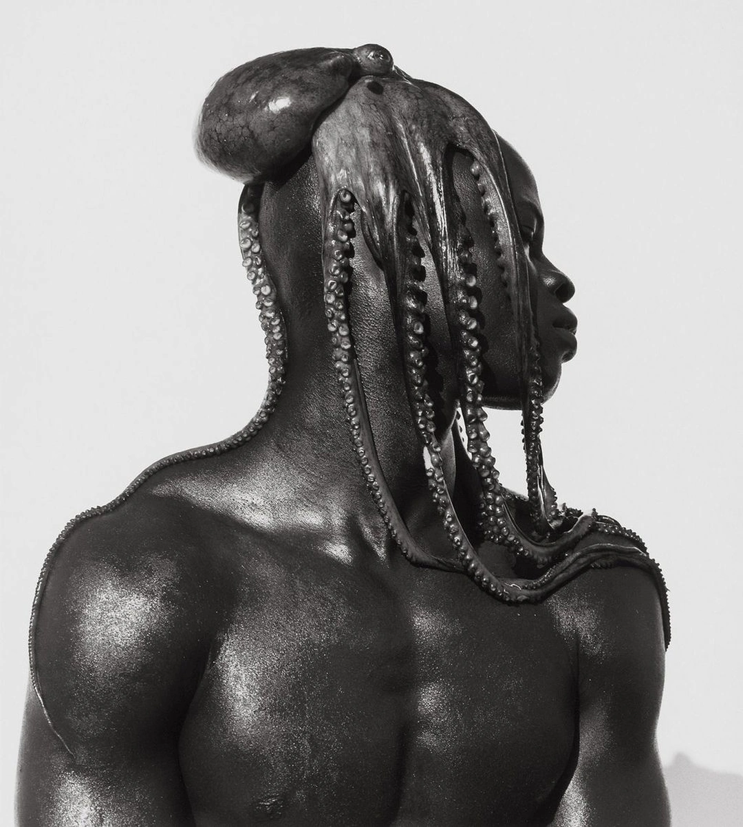 Profile of a bare-chested man with an octopus resting on his head and its tentacles hanging over his face and shoulders. Herb Ritts “Djimon with Octopus, Hollywood” 1989 Gelatin silver print Image: 50.8 x 40.6 cm (20 x 16 in.) Framed: 76.2 x 63.5 cm (30 x 25 in.) Hollywood, California, United States, North America The J. Paul Getty Museum, Los Angeles, Gift of Herb Ritts Foundation © Herb Ritts Foundation