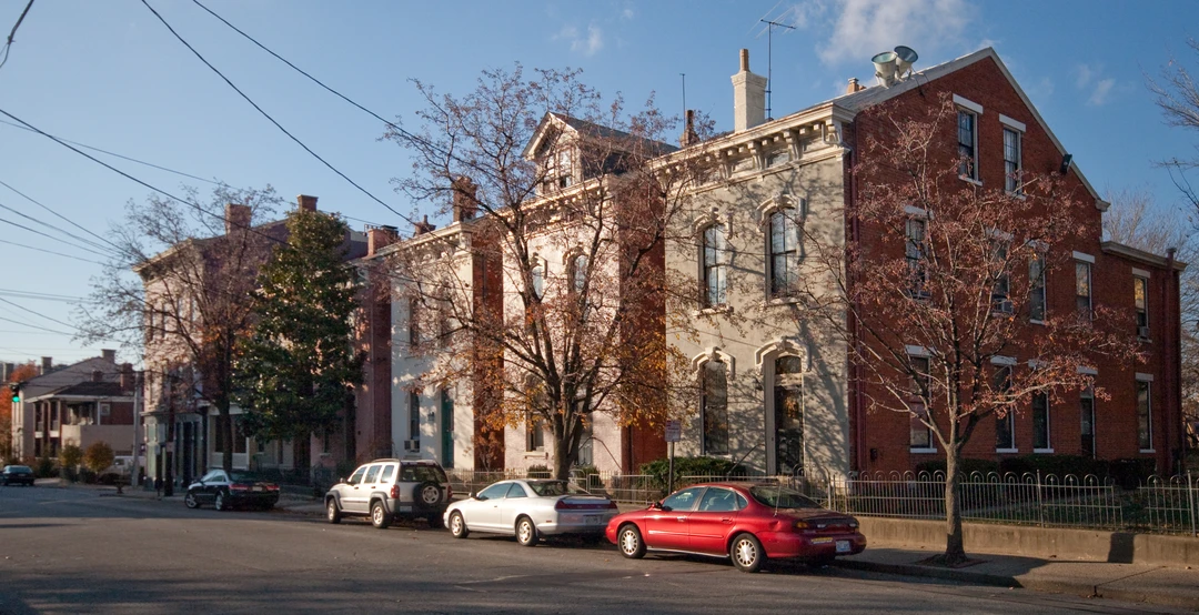 Street view of historic nineteenth-century brick townhouses and architectural details in the Mutter Gottes Historic District in Covington, Kentucky.