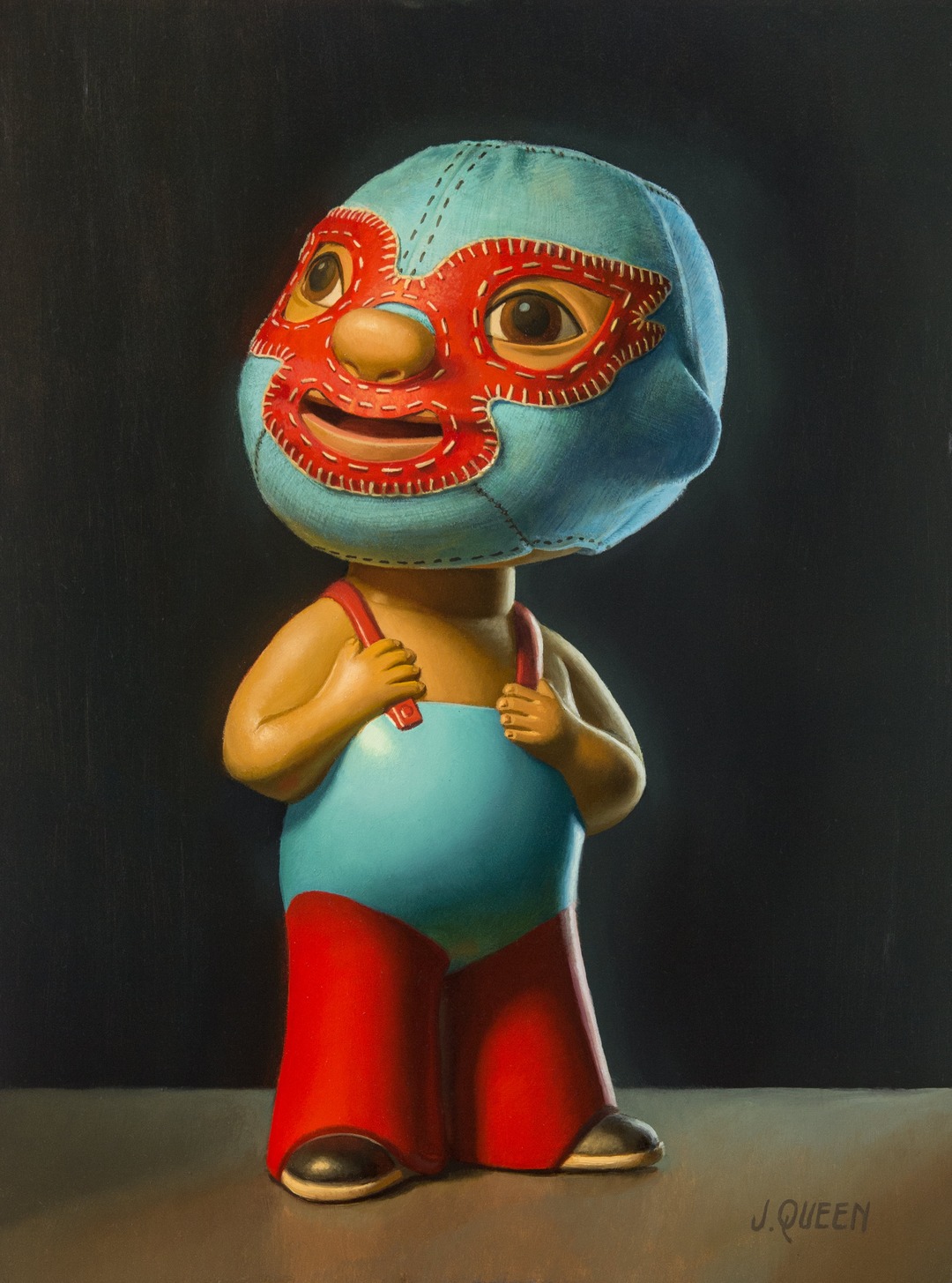 Wrestler figurine with a red stitched mask and red suspenders. Jonathan Queen, Grande Nino.