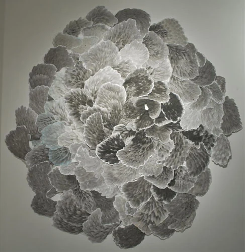 Circular ink collage of radiating petal-like forms in black, gray and white. Allison Svoboda, Svirla Centered, 5'-5" diameter. Image from the artist's website. (Related image located during this archive's reconstruction.)